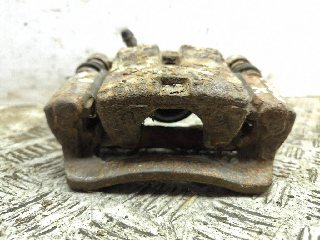 Rear brake caliper – left