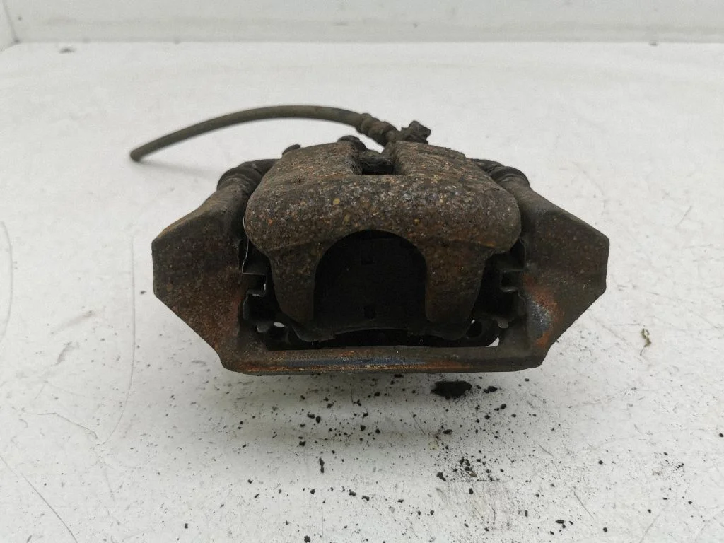 Rear brake caliper – left