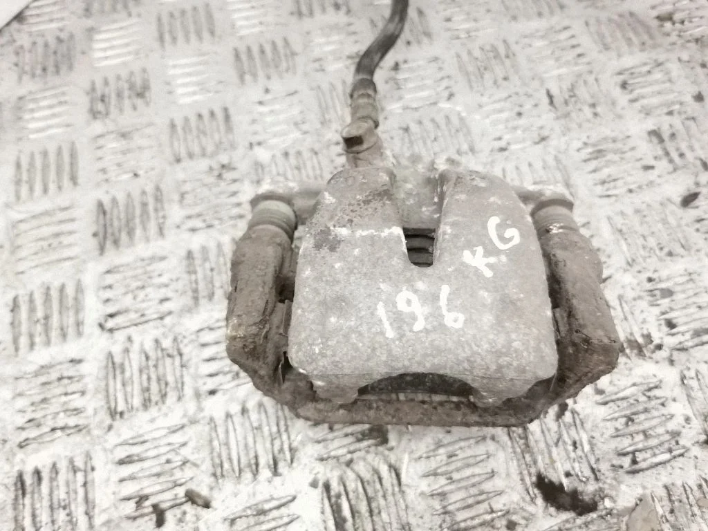 Rear brake caliper – left