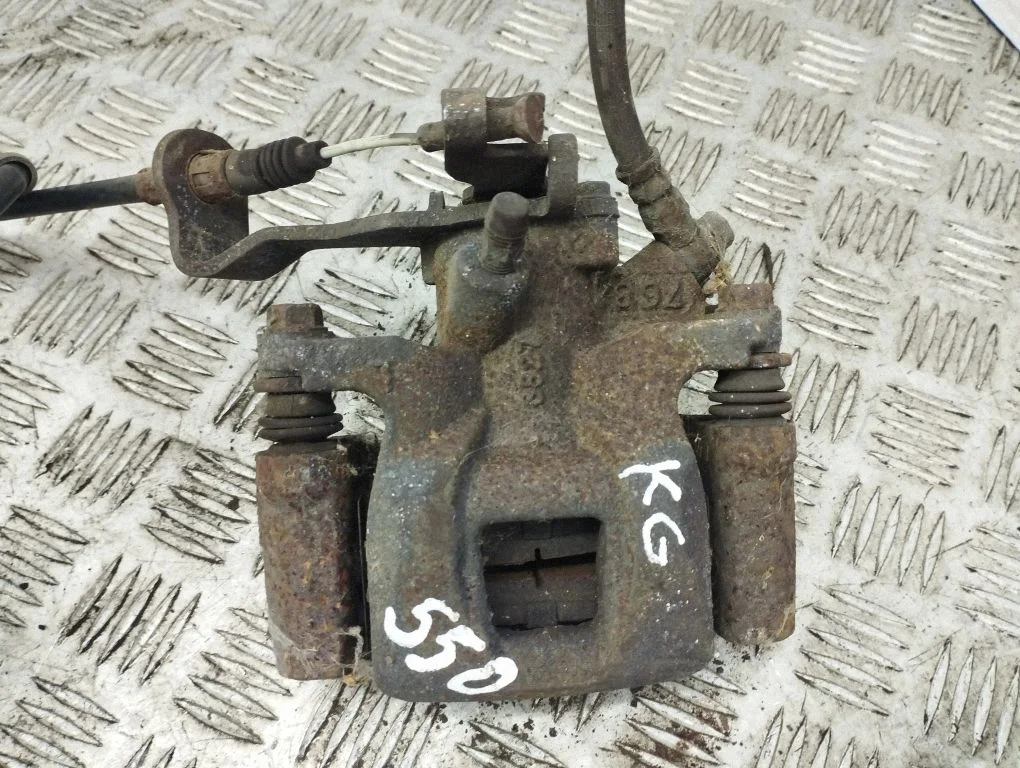 Rear brake caliper – left