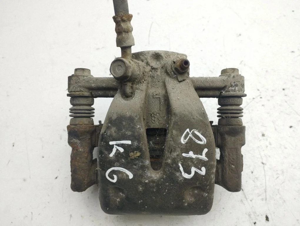 Rear brake caliper – left