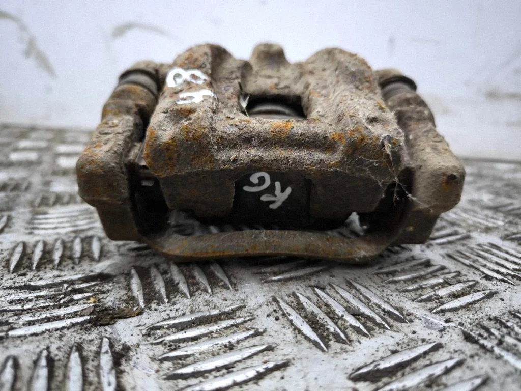 Rear brake caliper – left