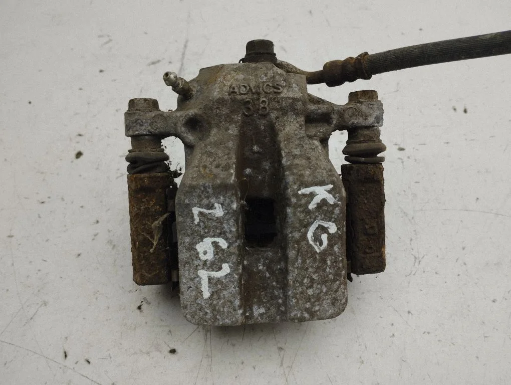 Rear brake caliper – left