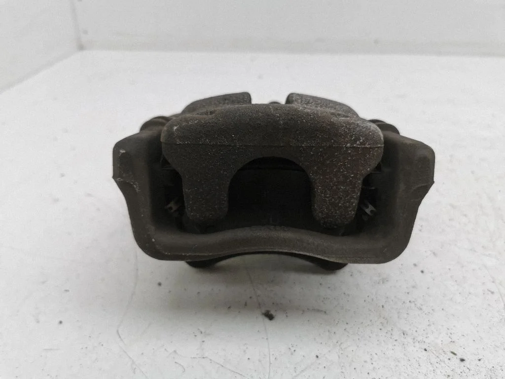 Rear brake caliper – left
