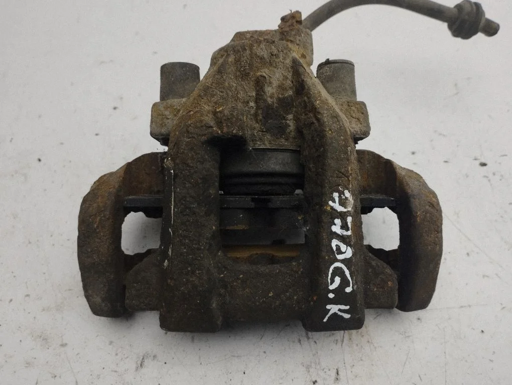 Rear brake caliper – left