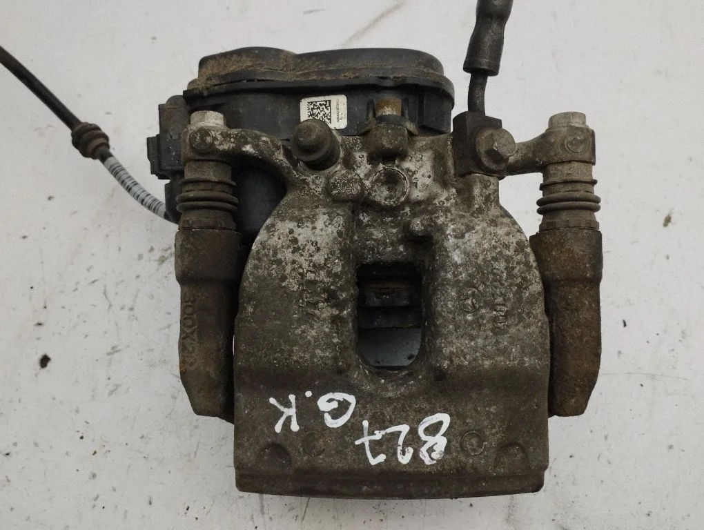 Rear brake caliper – left