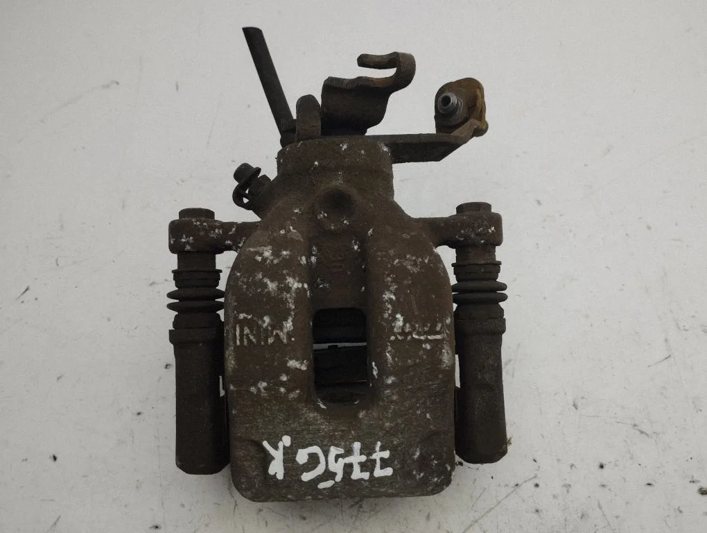 Rear brake caliper – left