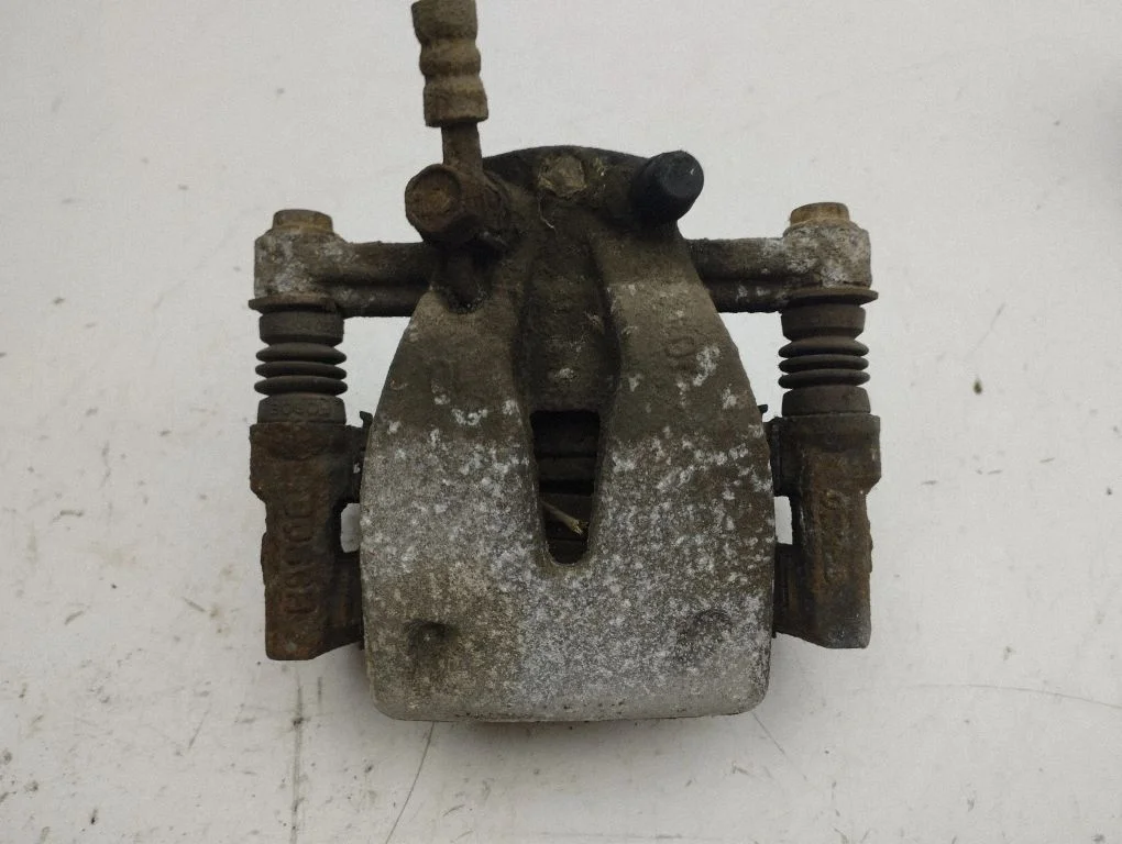 Rear brake caliper – left