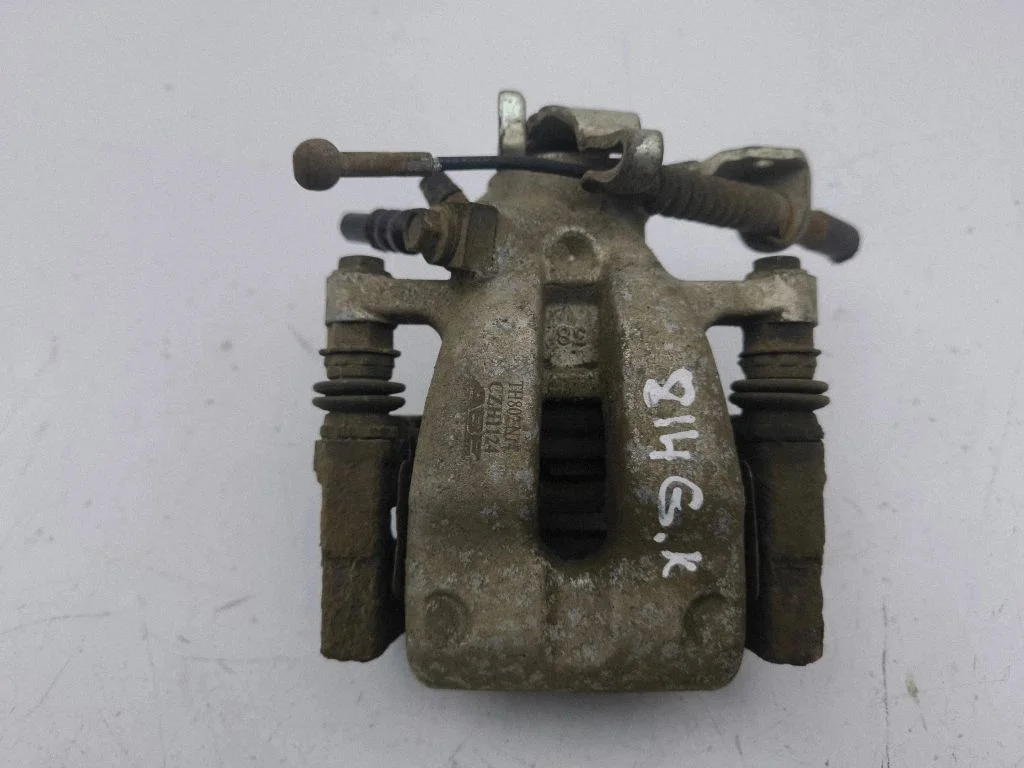 Rear brake caliper – left