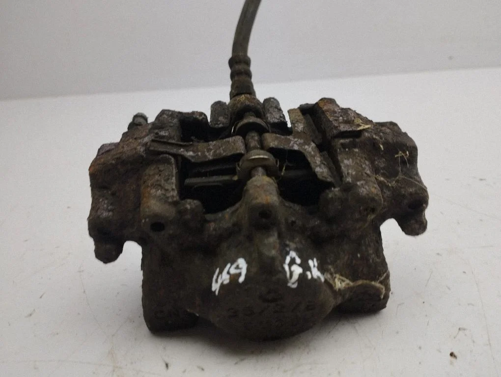 Rear brake caliper – left