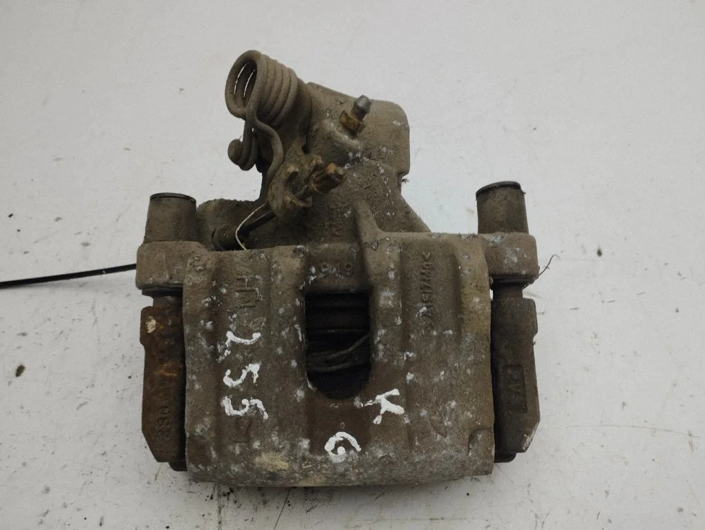 Rear brake caliper – left
