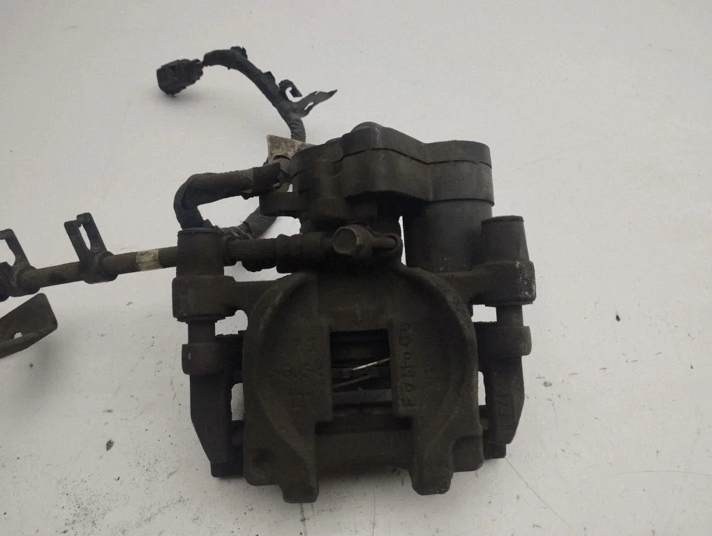 Rear brake caliper – left