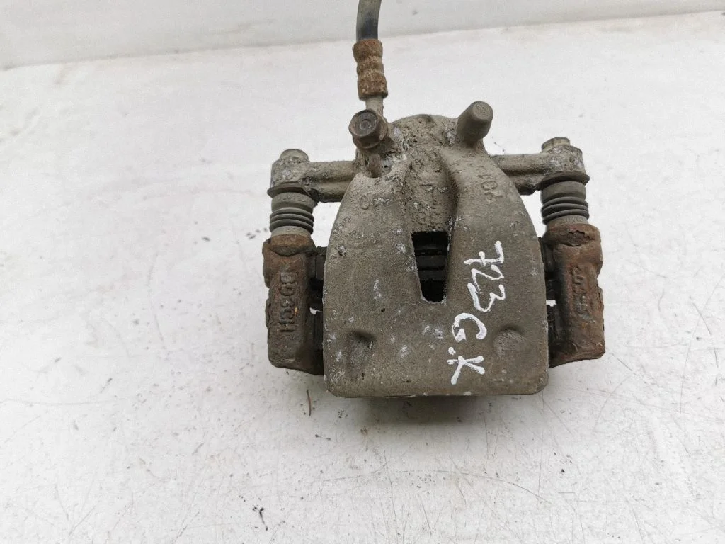 Rear brake caliper – left