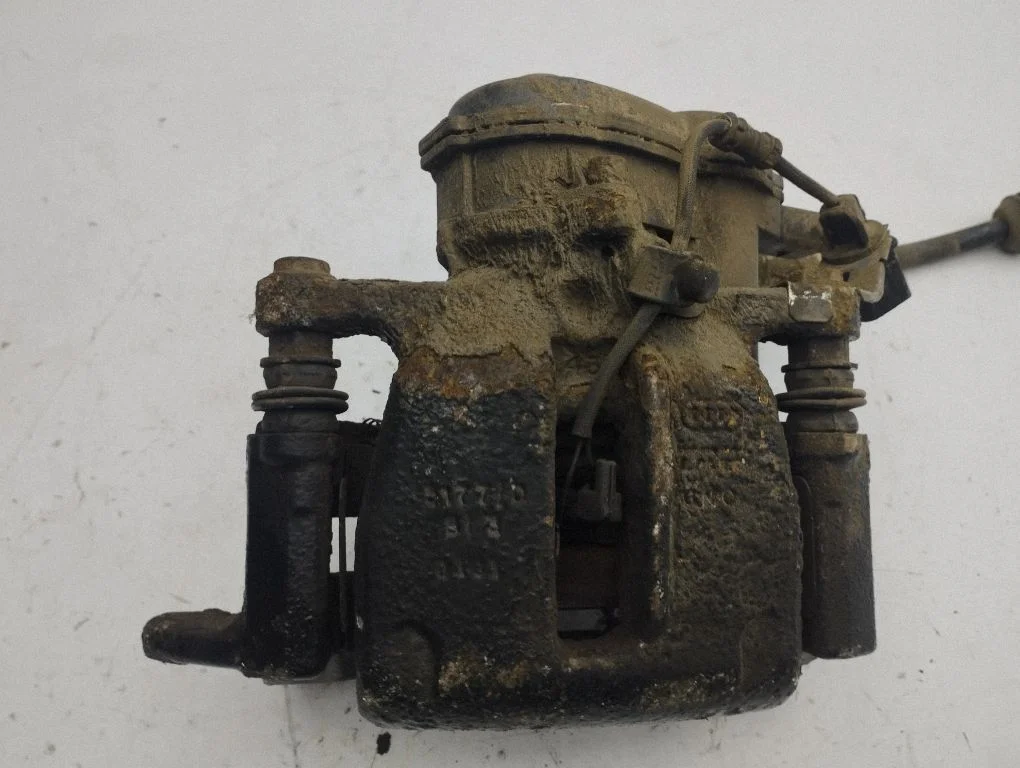 Rear brake caliper – left