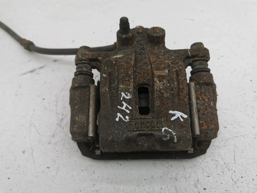 Rear brake caliper – left