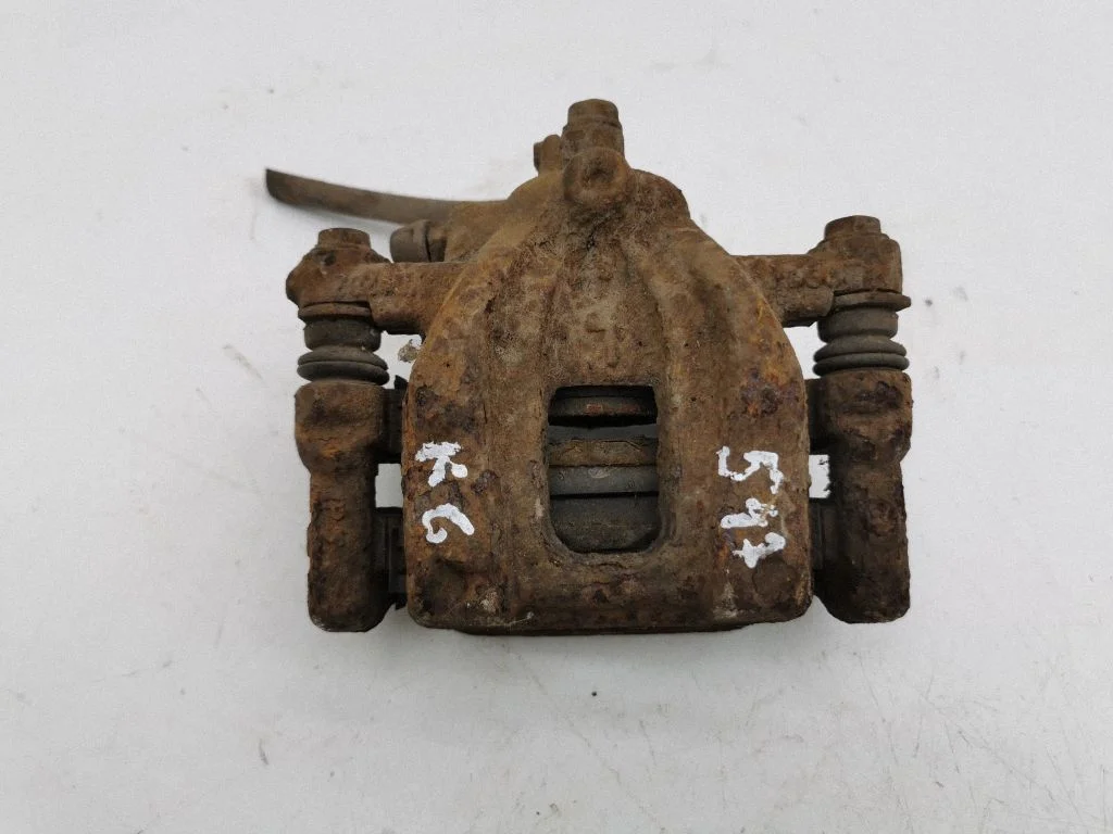 Rear brake caliper – left