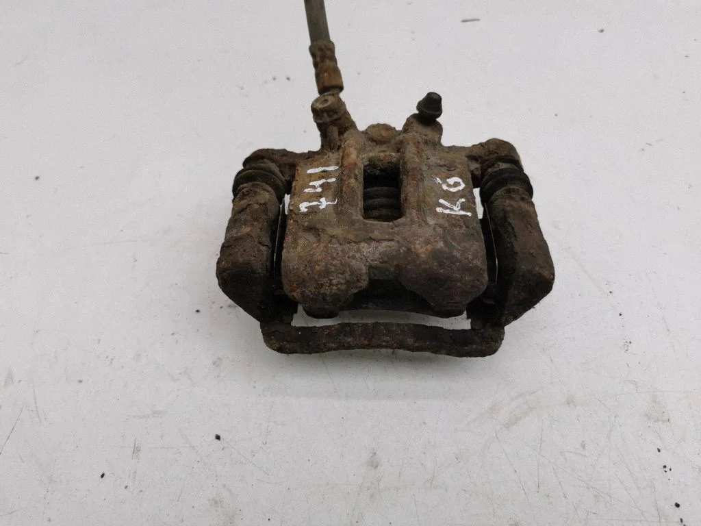 Rear brake caliper – left