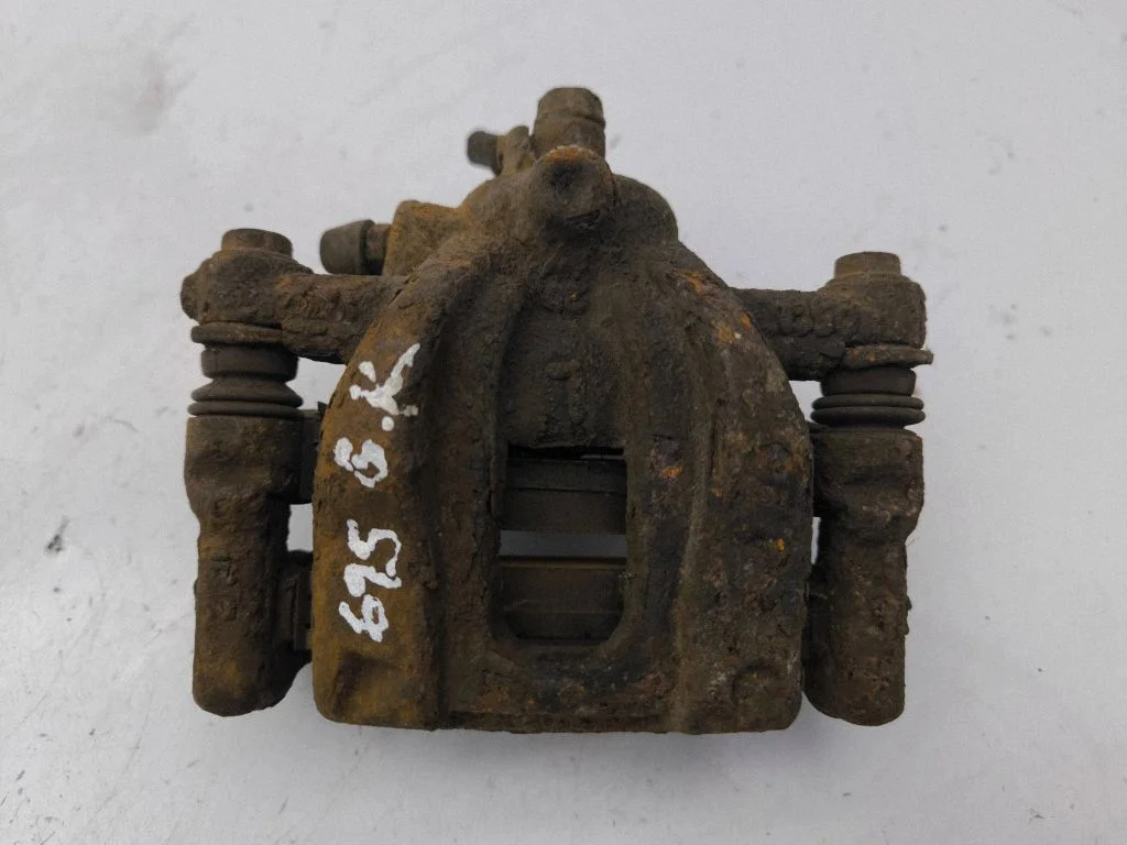 Rear brake caliper – left