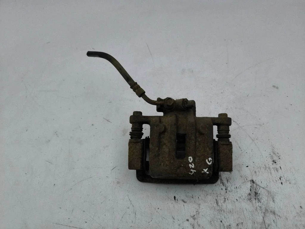 Rear brake caliper – left