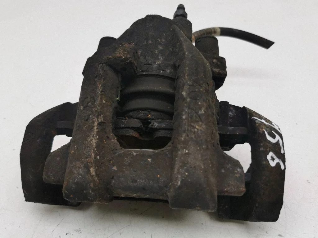 Rear brake caliper – left