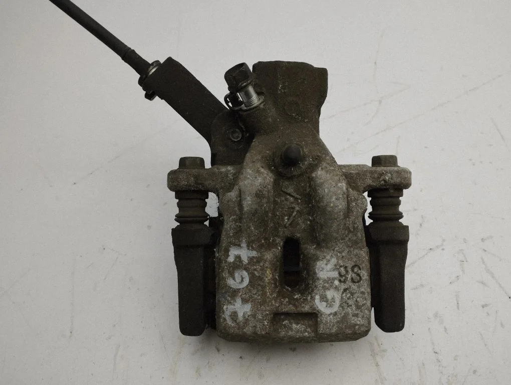 Rear brake caliper – left
