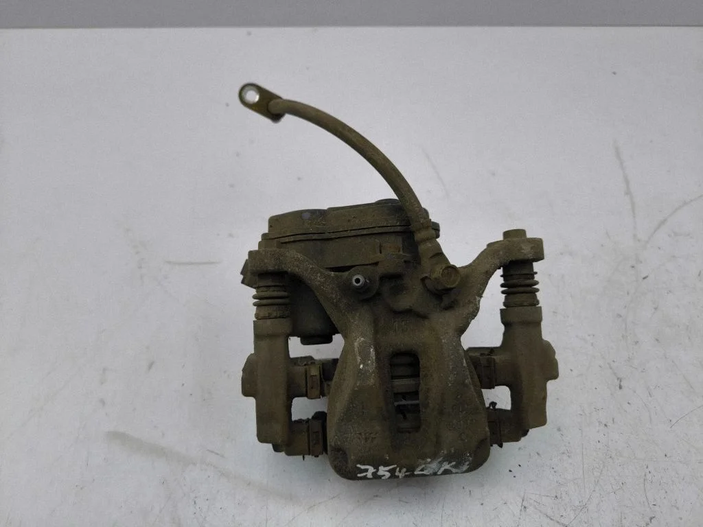 Rear brake caliper – left