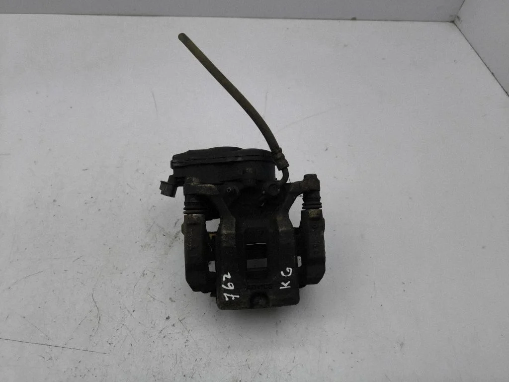 Rear brake caliper – left