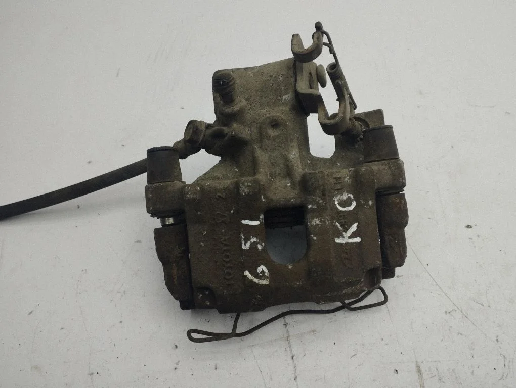 Rear brake caliper – left