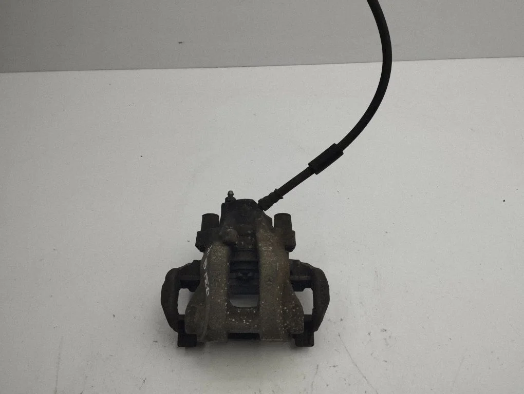 Rear brake caliper – left