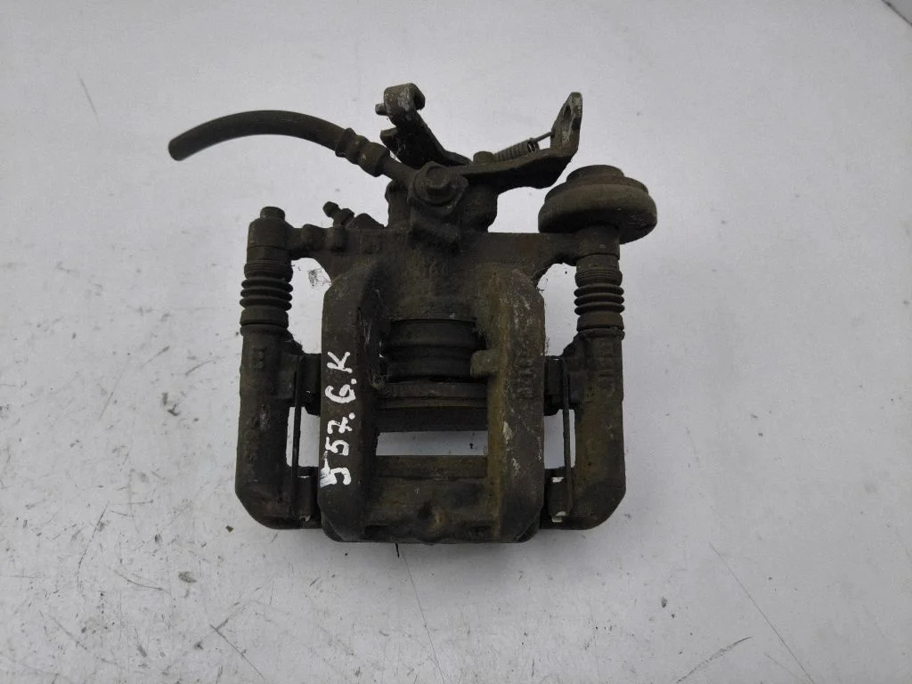 Rear brake caliper – left
