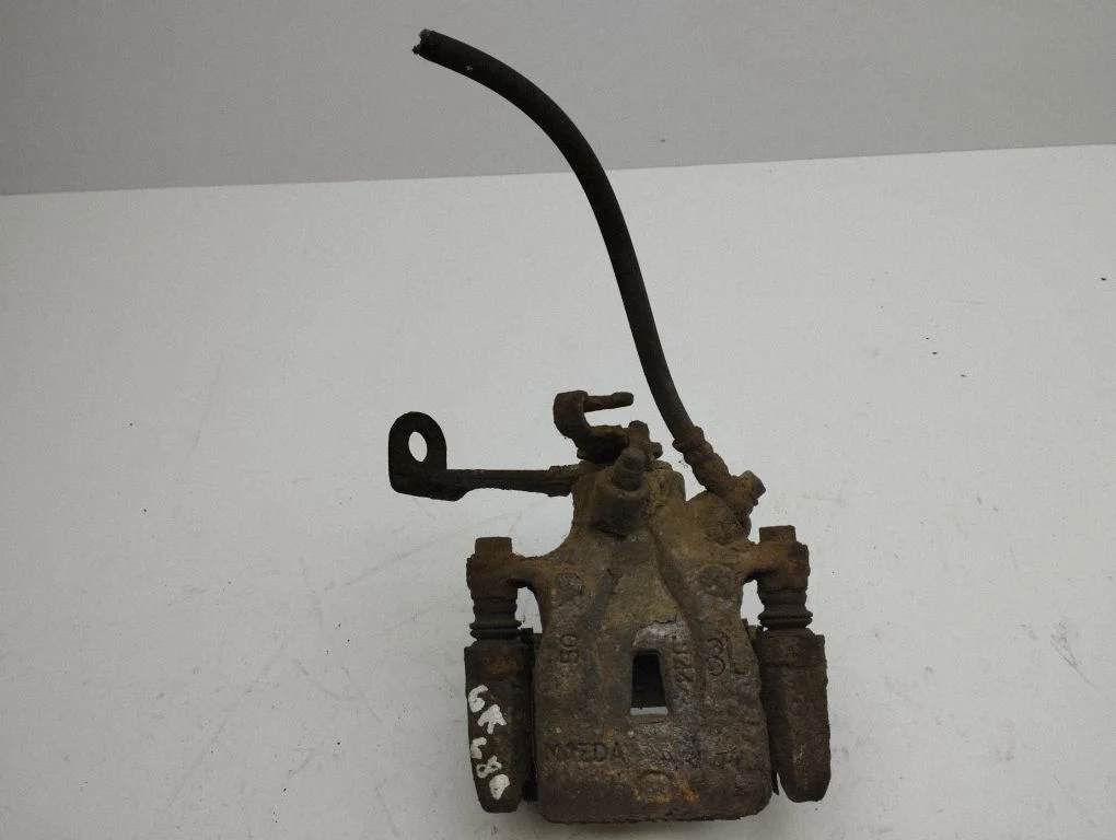 Rear brake caliper – left