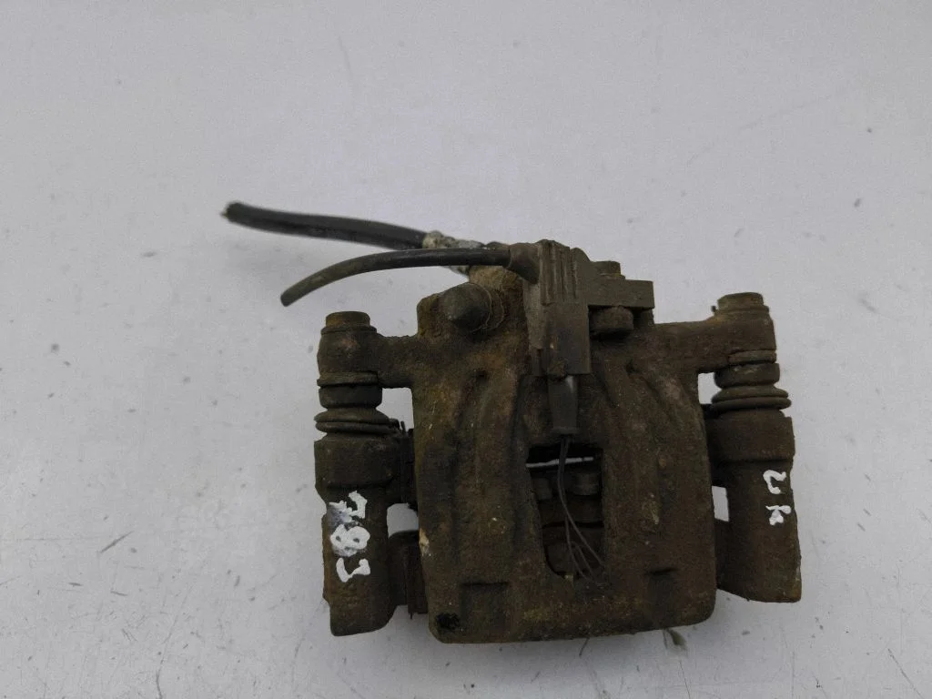 Rear brake caliper – left
