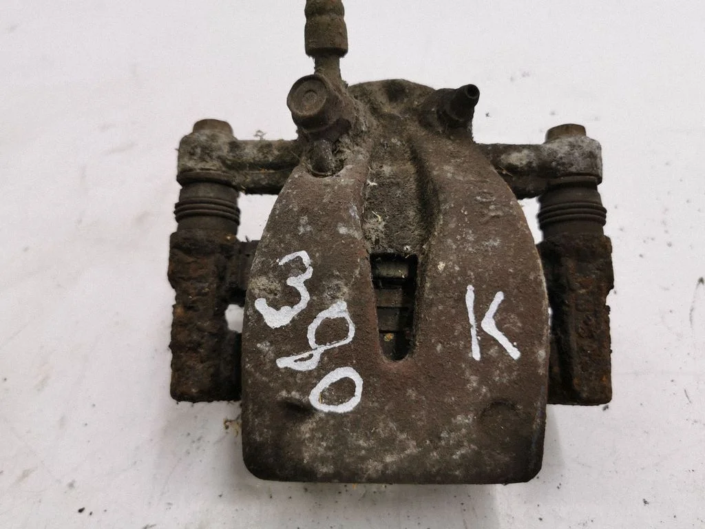 Rear brake caliper – left