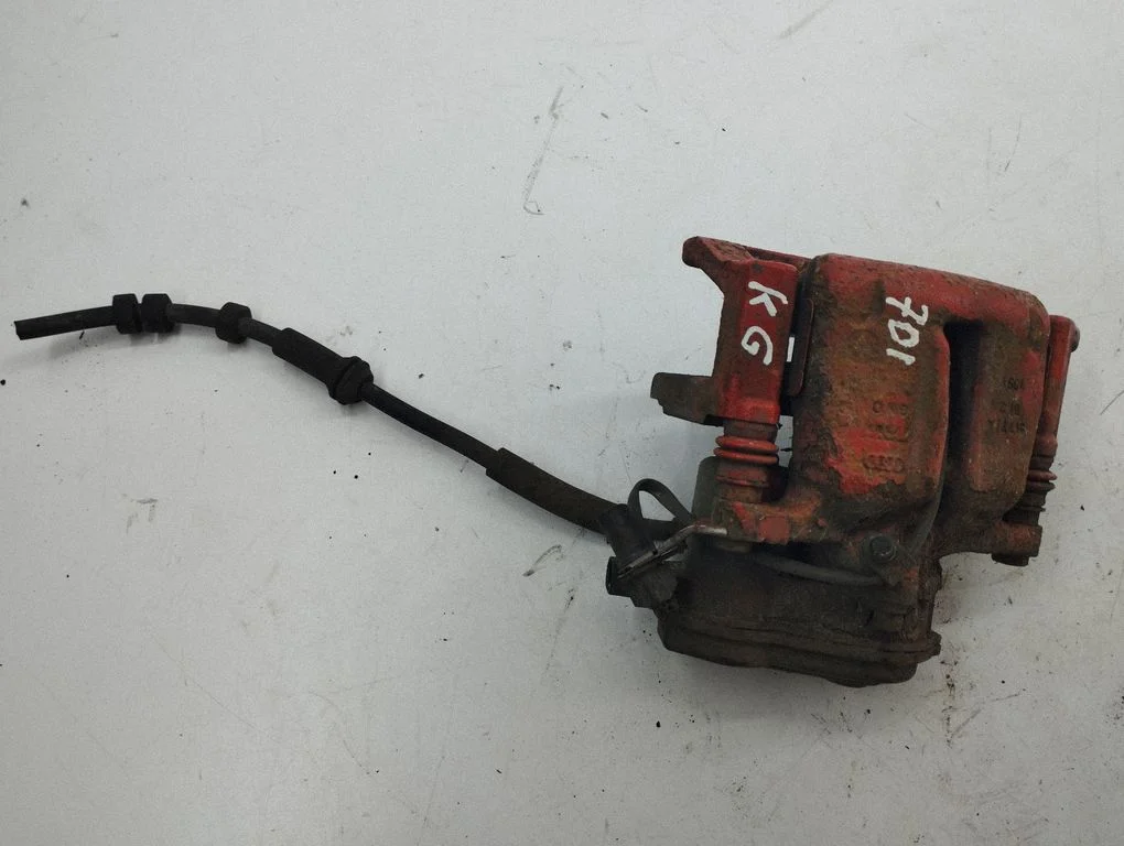 Rear brake caliper – left