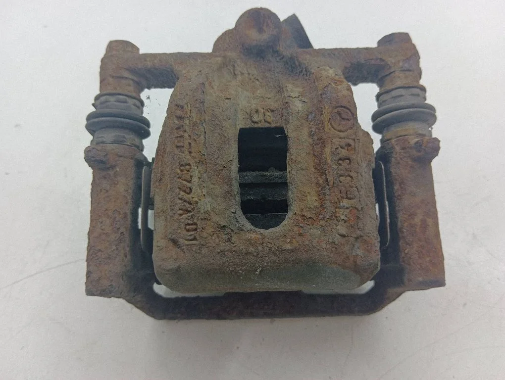 Rear brake caliper – left