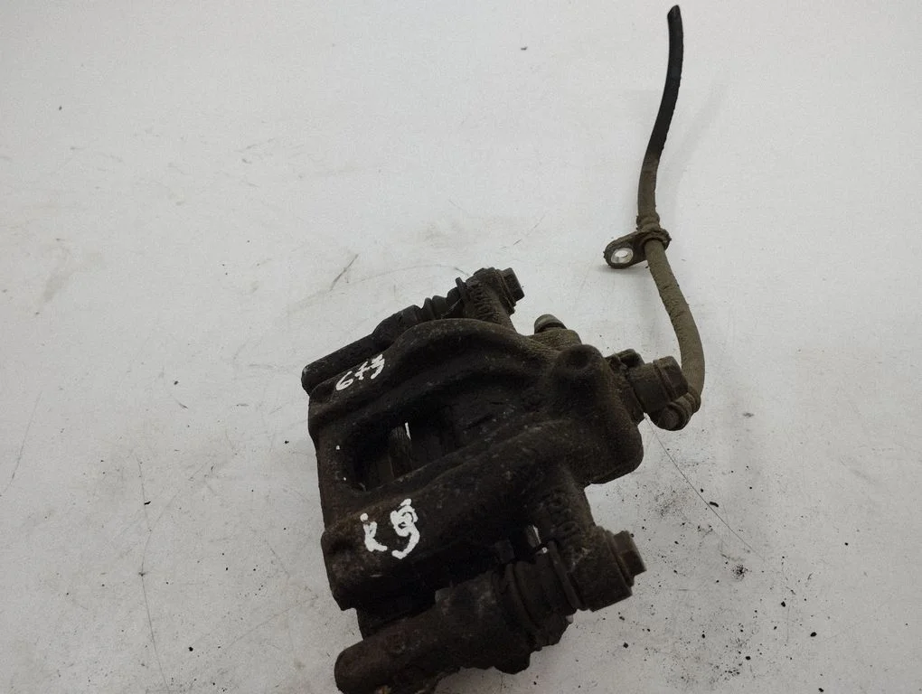 Rear brake caliper – left