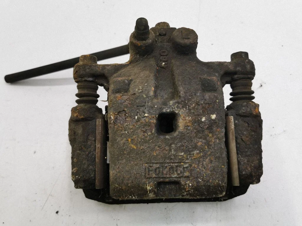 Rear brake caliper – left