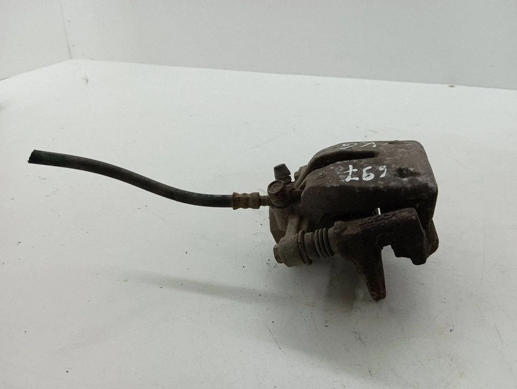 Rear brake caliper – left