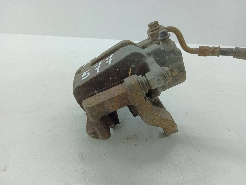 Rear brake caliper – left