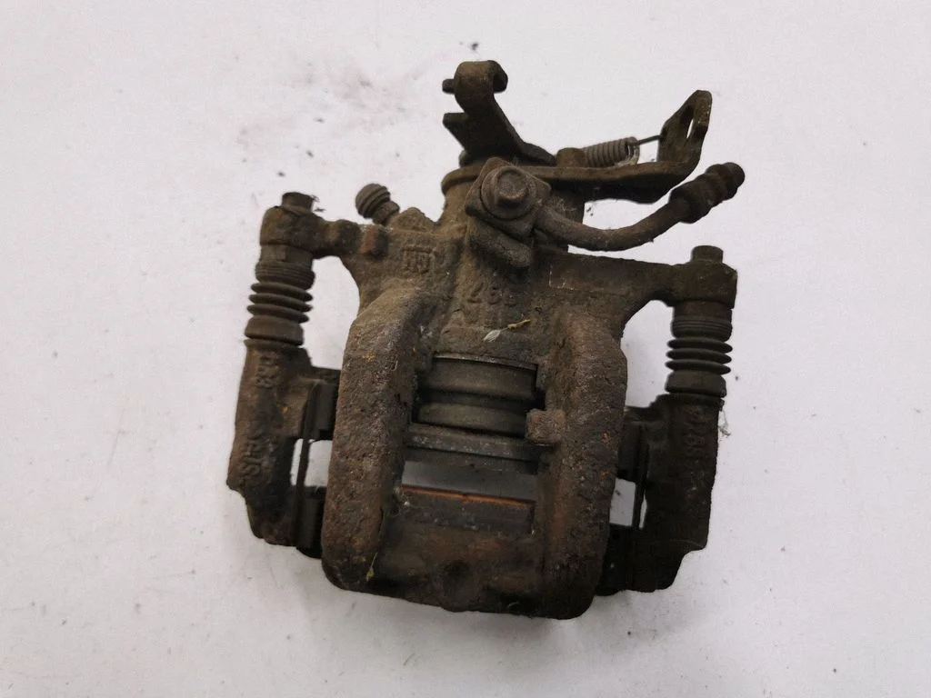 Rear brake caliper – left