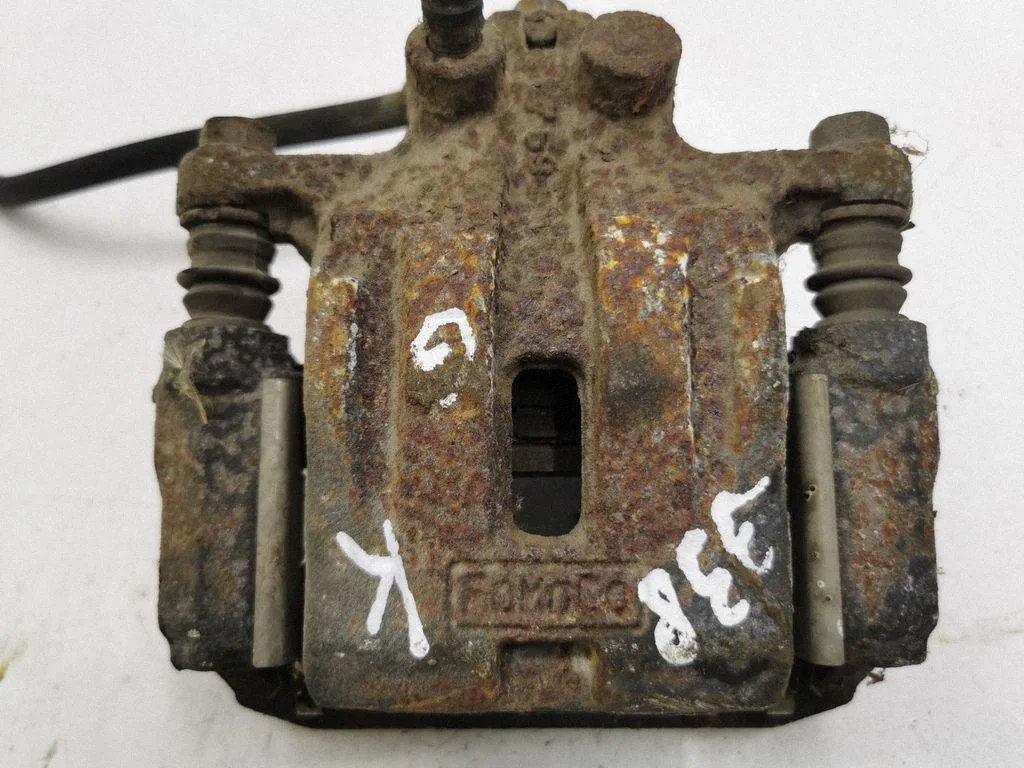 Rear brake caliper – left