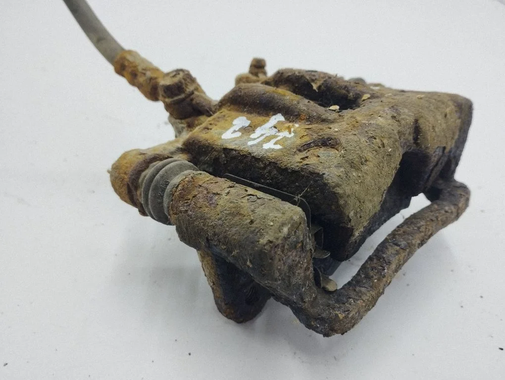 Rear brake caliper – left
