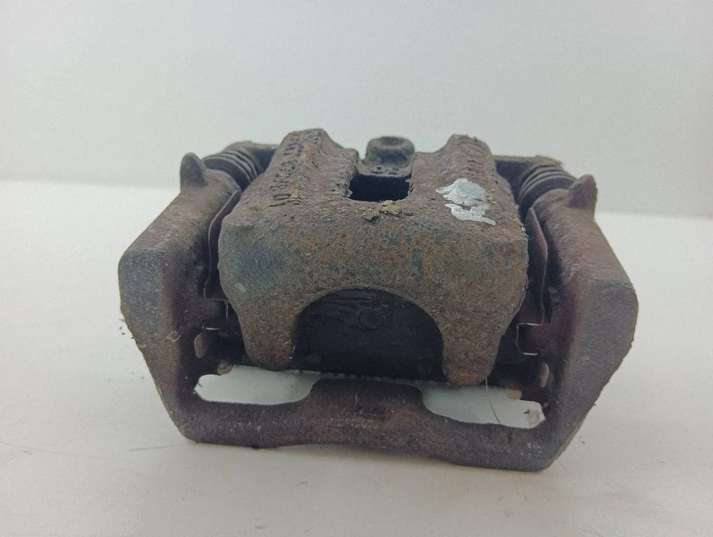 Rear brake caliper – left