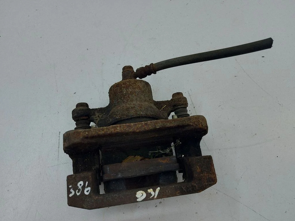 Rear brake caliper – left
