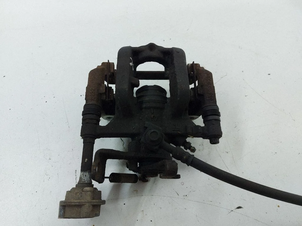 Rear brake caliper – left