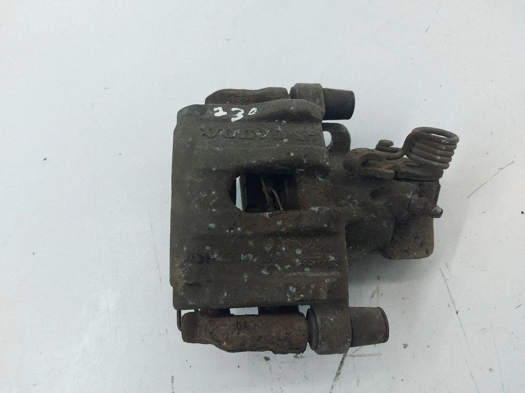Rear brake caliper – left