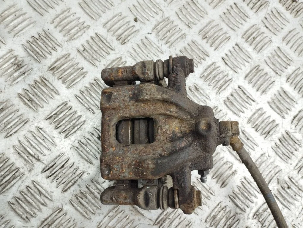 Rear brake caliper – right