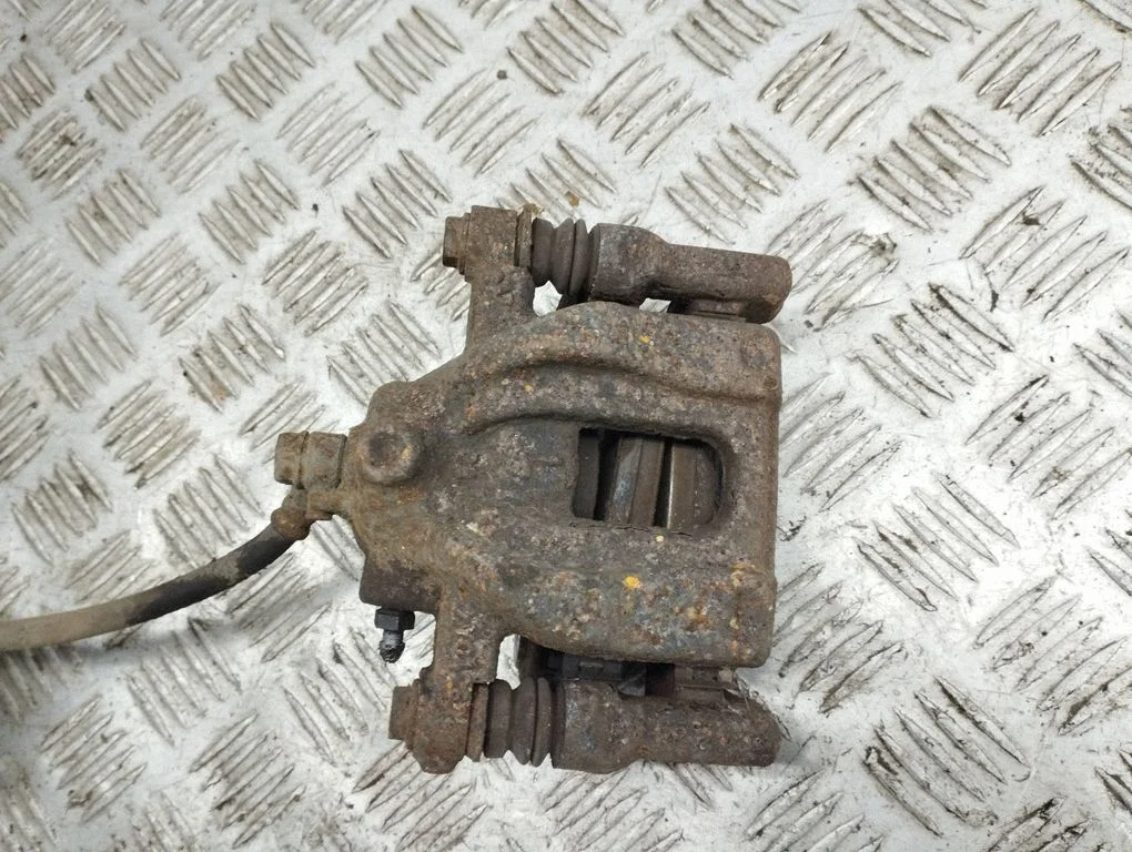 Rear brake caliper – left