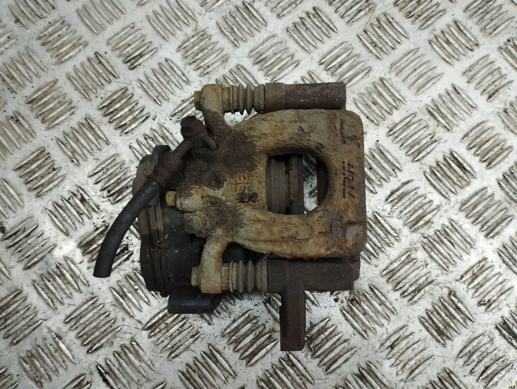 Rear brake caliper – left