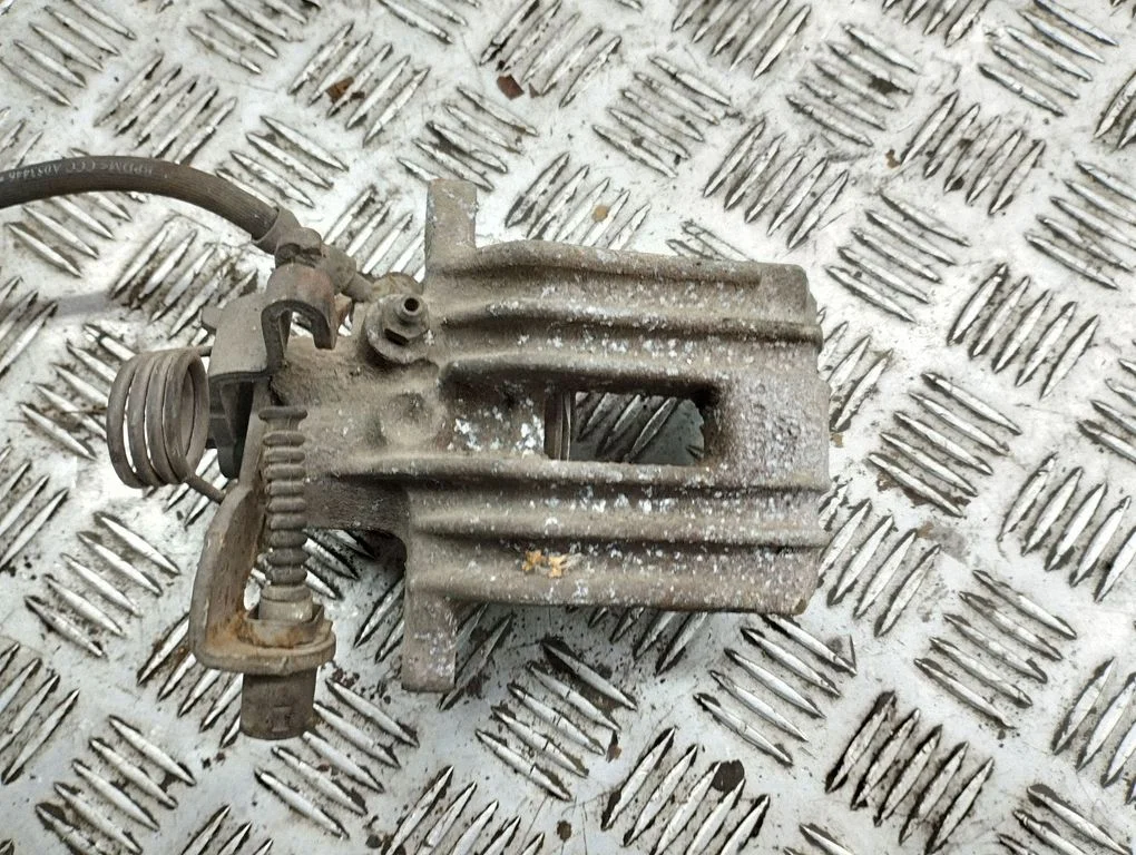 Rear brake caliper – right